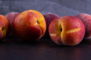 peaches lie on a black background