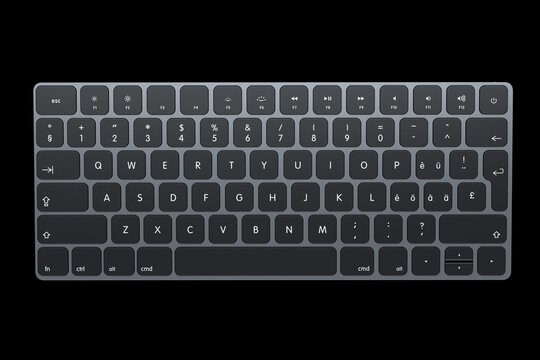Modern dark aluminum computer keyboard isolated on black background.