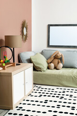 Montessori bedroom interior with floor bed and toys
