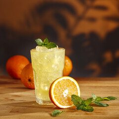 Orange juice on wooden desk and free space for your decoration 