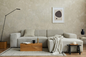Creative composition of stylish modern spacious living room with mock up poster frame, grey sofa,...