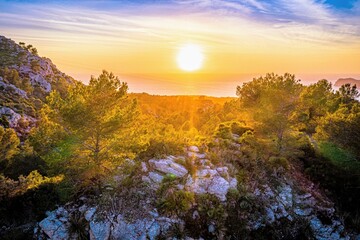 Sunrise in Cala Galdana, Menorca, Spain. view of sky, sea and sun