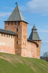 Fototapeta na wymiar Two towers of the ancient Kremlin of Veliky Novgorod close-up on a sunny April day. Russia