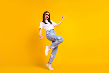 Fototapeta na wymiar Full body profile side photo of young excited girl happy positive smile play guitar isolated over yellow color background
