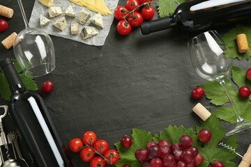 Naklejka na ściany i meble Frame of tasty red wine and snacks on black table, flat lay. Space for text