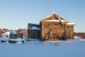 The ruins of an ancient wooden church of the Tikhvin Icon of the Mother of God close up on a...