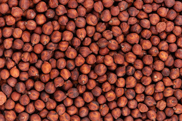 Brown chickpeas background. Red chickpea bean. Garbanzo, bengal gram or chick pea bean.