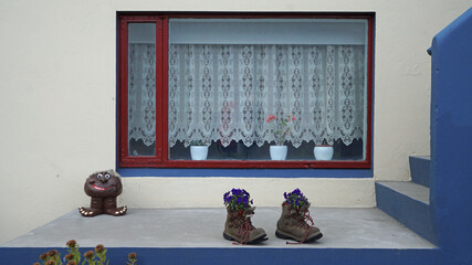 traditional window, with flowers in shoes, Isafjordur, Iceland