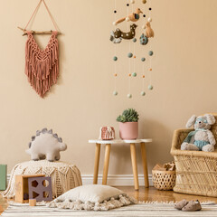Stylish scandinavian interior of child room with mock up frame, natural toys, hanging decoration, design furniture, plush animals, teddy bears and accessories. Interior design of kid room. Template.