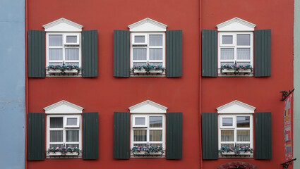 windows of an house, red wall, Reykjavik, Iceland