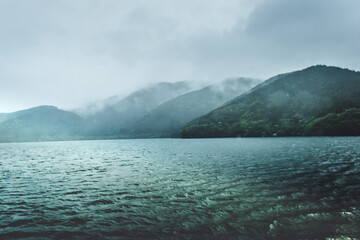 Lake Ashi and Fuji mountain under mist