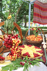 White and red cherries in wicker basket, cherry festival
