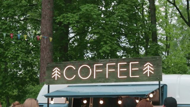 vans with street food bar festival in the city park.concept small business and holiday summer.