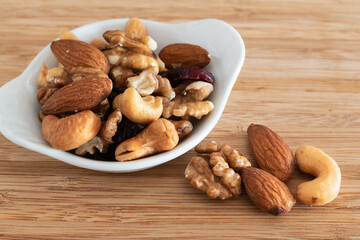 Mix of nuts on wooden background