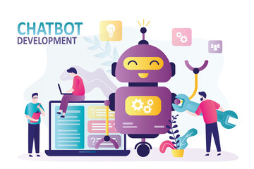 Worker programs chatbot through laptop. Development team adjusts and improves robot interface