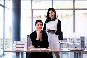 Asia cheerful businesswoman working at the table in office