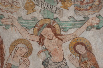 Christ is nailed to the cross, a green trunk