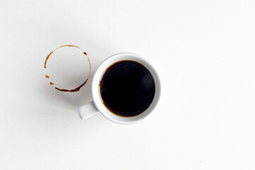 Obraz na płótnie Canvas Coffee mockup. White ceramic mug with espresso or americano hot coffee on blank dirty surface, table.