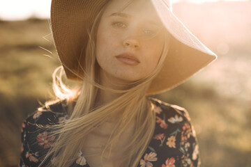 portrait of young cheerful woman with hat
