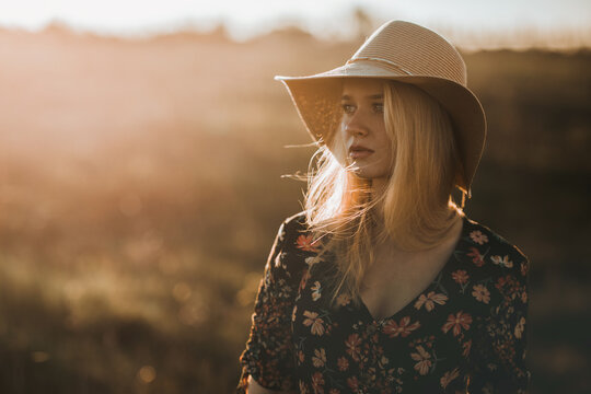 young dreamy woman with hat