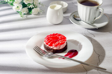 Cake with berri marshmallow and coffee for breakfast on light grey table