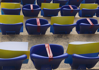 Seats in a football stadium during a pandemic