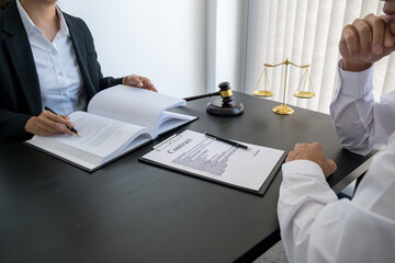  Judge gavel with Justice lawyers having team meeting at law firm background. Concepts of Law and...