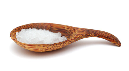 wooden spoon full of coarse grain sea salt from Gran Canaria isolated on white background
 - obrazy, fototapety, plakaty