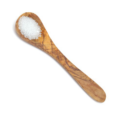 wooden spoon full of coarse grain sea salt from Gran Canaria isolated on white background
