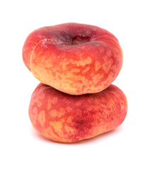 Large yellow and red flat peach fruit isolated on white background