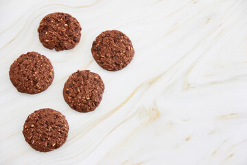 sweet crunchy oatmeal cookies with chocolate pieces