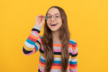 happy schoolgirl nerd kid in eyeglasses for vision, eyesight