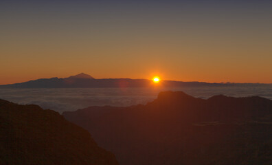 Gran Canaria, landscape of the central part of the island, Las Cumbres, ie The Summits, short hike between rock Formation 
Chimirique and iconic Roque Nublo, evening light
