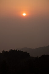 sunrise behind the mountain on the early morning in kodanad tea estate. Sunrise behind on the kodanad tea estate with treas