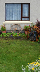 Fototapeta na wymiar wooden house with flowers, Lerwick, Scotland