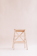 New wooden ladder on the white background. isolated stepladder. Space for text