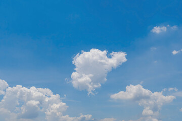 Bright blue sky with fluffy white clouds, The idea for the feeling of fresh weather, Bright blue sky with fluffy white clouds, Clean on a hot sammer day. Fresh blue sky and soft white clouds.