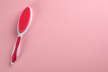 Pedicure tool with pumice stone on pink background, top view. Space for text