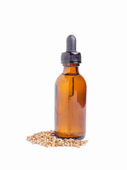 Medicinal cannabis with extract oil in a bottle and cannabis seeds isolated on white background. Space for text