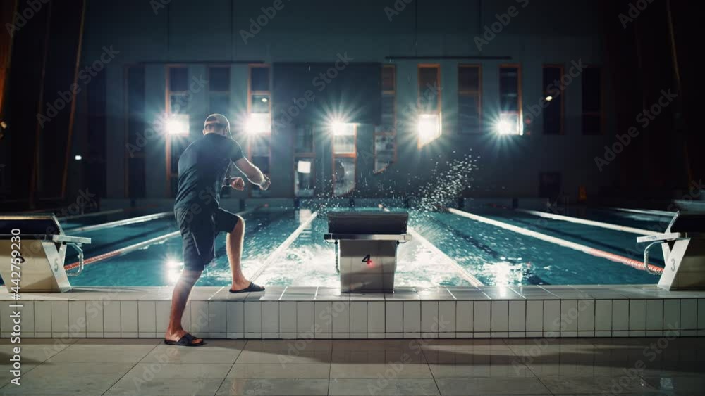 Canvas Prints Swimming Pool: Professional Trainer Training Future Champion Swimmer. Swimmer Dives and Trainer Times Lap with Stopwatch. Team Ready for World Record and Victory. Cinematic Wide Slow Motion