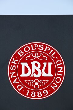 Tilst, Denmark - April 18, 2021: Emblem of the Danish national football team on a building
