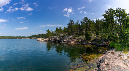 Naklejka premium beautful archipelago with islands and forest landscape on the ocean coast on a summer day