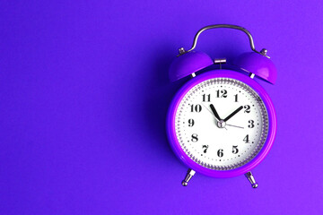 purple alarm clock with copy space