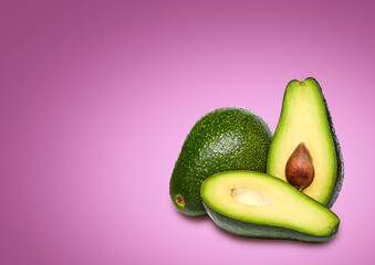 Composition of ripe avocados on a bright background.