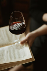 glass of wine in hand of person