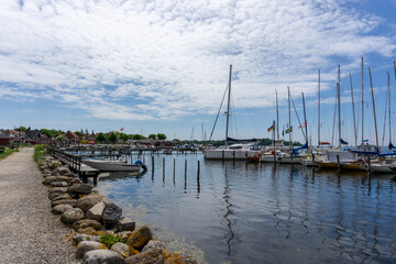 Obraz premium view of the harbor front promenade and marina and yacht harbor in Nysted