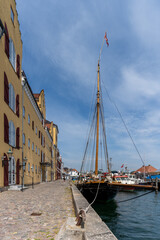 Fototapeta na wymiar the old harbor front in Svendborg with historic wooden boats in the open-air maritime museum on the waterfront