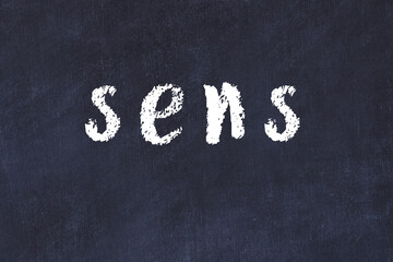 College chalk desk with the word sens written on in © iushakovsky
