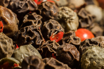 closeup of black and red peppercorns. macro photography. Spices for cooking food.