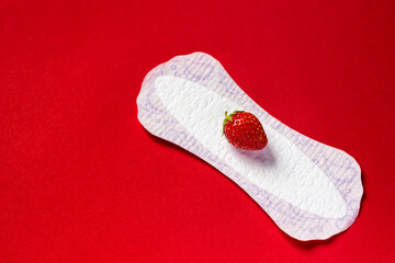 Feminine hygiene panty liner for menstruation. Menstrual cycle, pad. red background.
